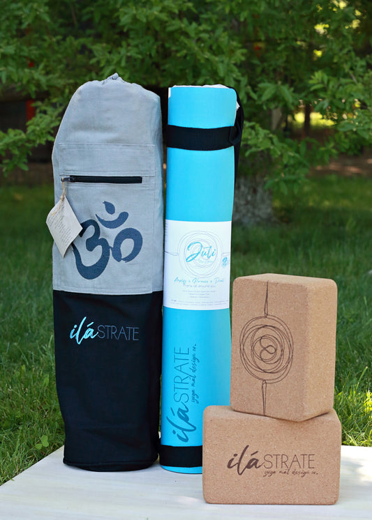 yoga mat and yoga mat back and cork yoga blocks placed on a board outside with green grass and trees in the background. Showcases the yoga bundle with bag, yoga mat and set of cork blocks pro mat by ilastrate yoga mat design co.